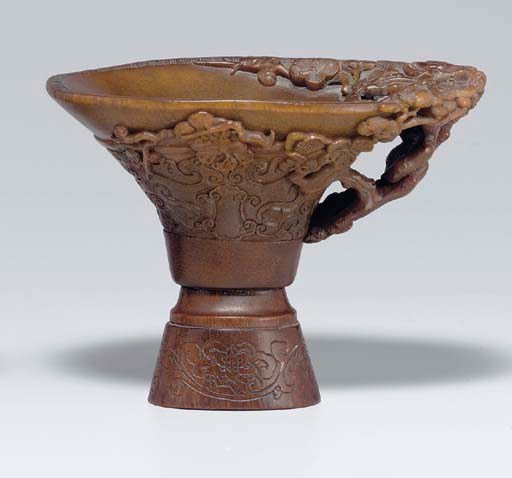 **AN ARCHAISTIC RHINOCEROS HORN LIBATION CUP