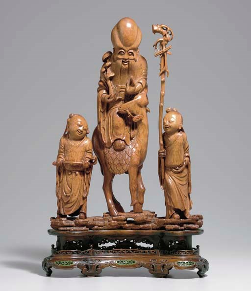 AN UNUSUAL CARVED BAMBOO FIGURAL GROUP OF SHOULAO AND  ATTENDANTS
