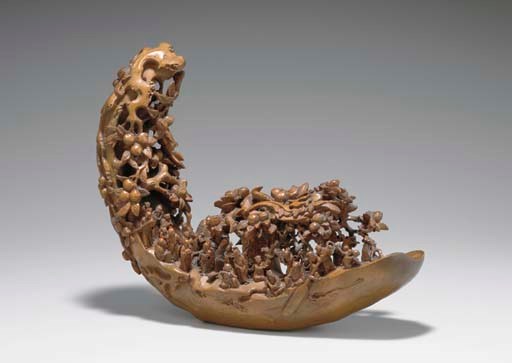 A BAMBOO CARVING OF IMMORTALS IN A LOG BOAT
