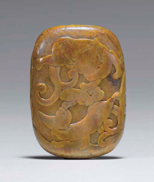 A RARE CARVED IVORY PENDANT