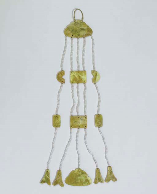 A Serpentine and Glass Pendant