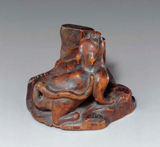A Carved Wood Table Ornament