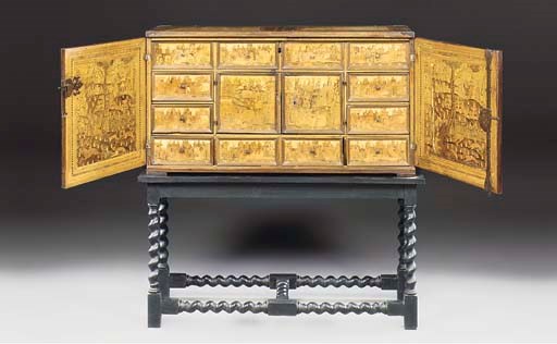 A SOUTH GERMAN IRON MOUNTED ASH, BOG-OAK AND FRUITWOOD MARQUETRY CABINET