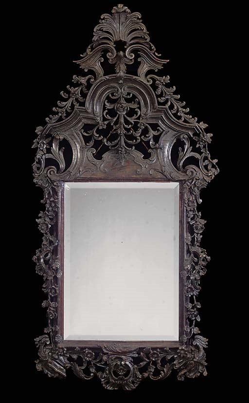 A PORTUGUESE CARVED OAK MIRROR