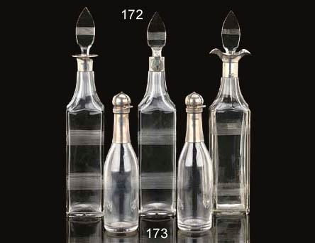A PAIR OF FRENCH SILVER MOUNTED GLASS DECANTERS
