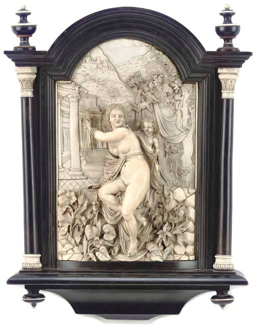 AN IVORY AND EBONISED PLAQUE