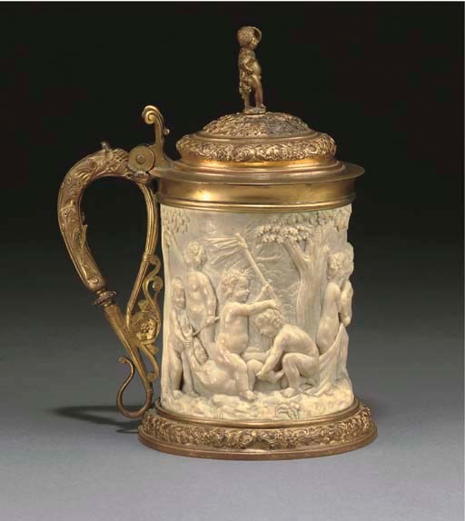 A CONTINENTAL GILT BRONZE MOUNTED IVORY TANKARD