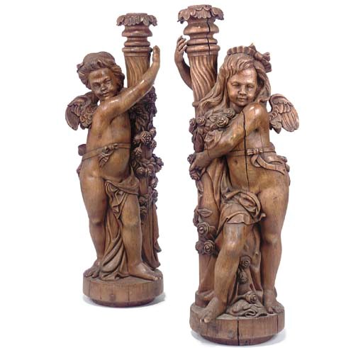 A PAIR OF CARVED WOOD TORCHERE FIGURES