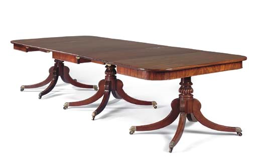 A GEORGE III MAHOGANY TRIPLE PEDESTAL DINING TABLE