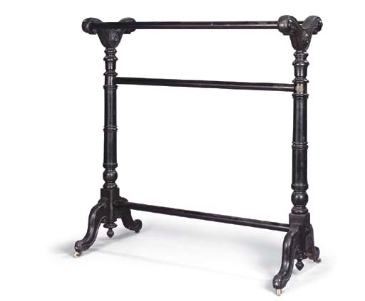 AN EARLY VICTORIAN EBONISED BLANKET RACK