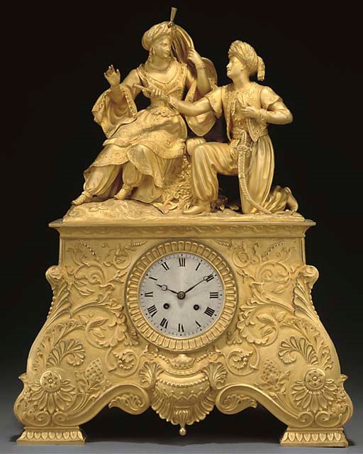 A FRENCH GILT-BRONZE MANTEL CLOCK