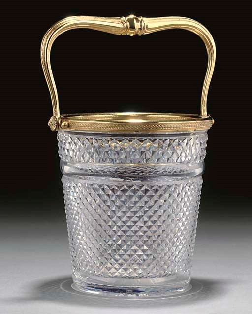 A GILT METAL MOUNTED CUT GLASS WINE COOLER