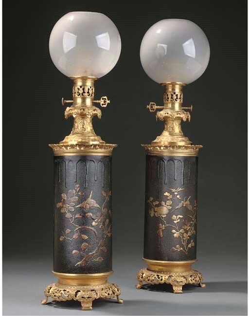 A PAIR OF GILT BRONZE MOUNTED IRON TABLE LAMPS