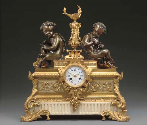 A FRENCH GILT BRONZE AND WHITE MARBLE MANTEL CLOCK