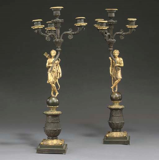 A PAIR OF FRENCH GILT AND PATINATED BRONZE FOUR-LIGHT CANDELABRA