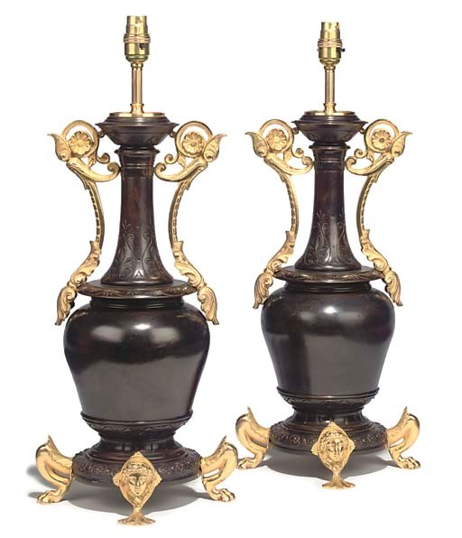 A PAIR OF FRENCH GILT AND PATINATED BRONZE TABLE LAMPS