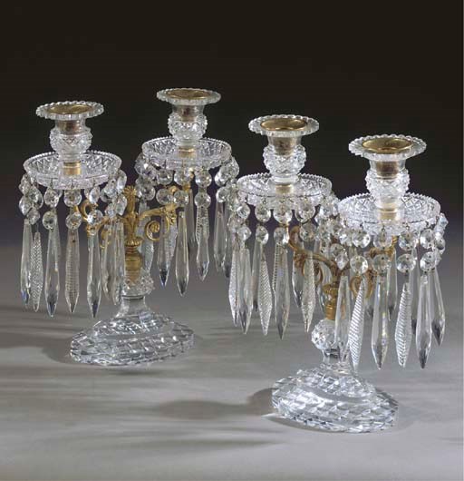 A PAIR OF CUT-GLASS AND GILT METAL TWIN-LIGHT CANDELABRA