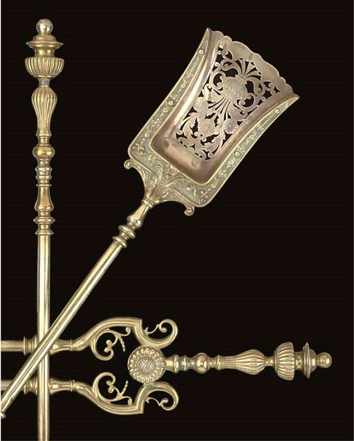 A SET OF THREE BRASS FIREIRONS
