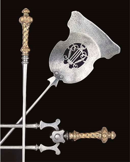 A SET OF THREE VICTORIAN POLISHED STEEL AND BRASS FIRE IRONS