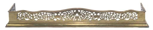 A LATE VICTORIAN BRASS FENDER