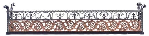 AN ARTS AND CRAFTS STEEL AND BRASS FENDER