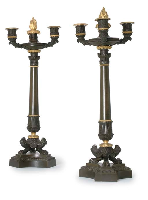 A PAIR OF RESTAURATION BRONZE AND ORMOLU FOUR LIGHT CANDELABRA