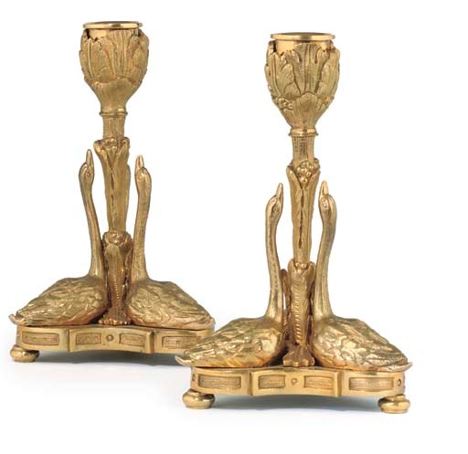 A PAIR OF GEORGE IV GILT BRASS CANDLESTICKS