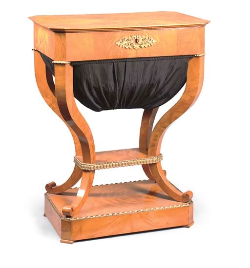 A SOUTH GERMAN BIRCH AND GILT GESSO WORK TABLE