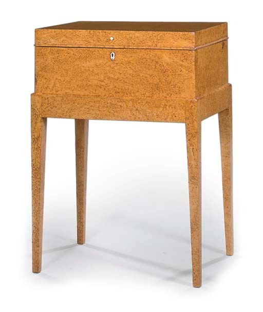 A NORTH EUROPEAN KARELIAN BIRCH WORK BOX ON STAND