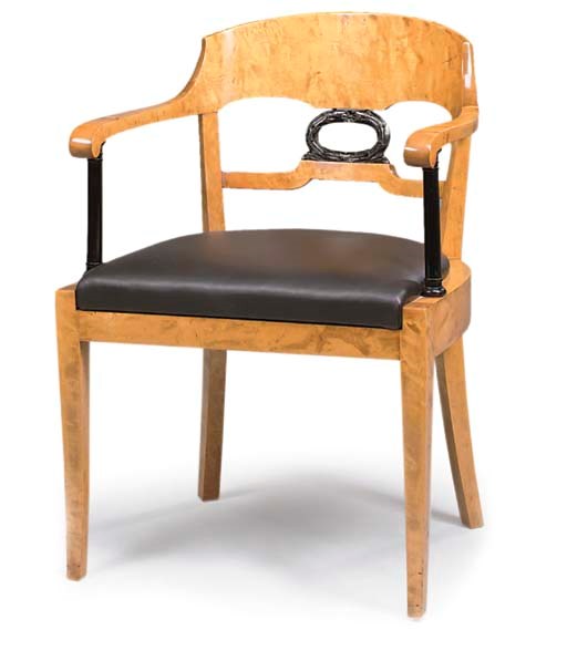 A BIEDERMEIER STYLE BIRCH AND EBONISED ARMCHAIR