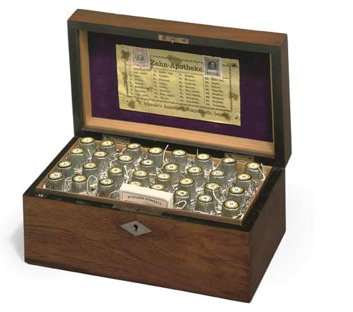 An early 20th-Century German walnut homoepathic domestic medicine chest,