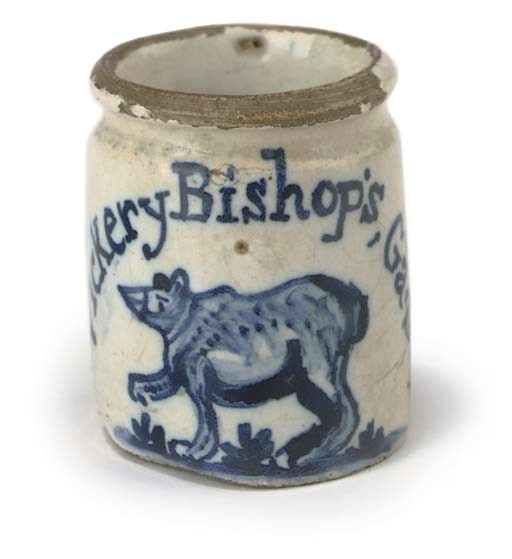 A rare and attractive miniature early 18th-Century blue and white English Delft bear's grease-pot,