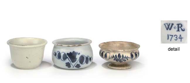 An attractive blue and white English Delft ointment-pot dated 1734,