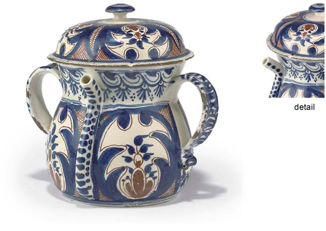 An early 18th-Century English Delft posset pot and cover,