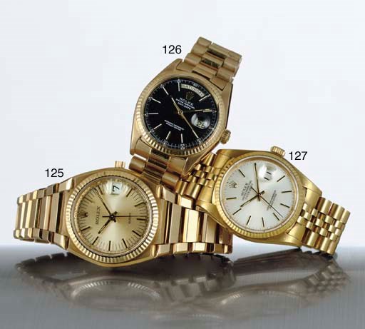 ROLEX. AN 18K GOLD AUTOMATIC WRISTWATCH WITH CENTER SECONDS, DAY, DATE AND BRACELET