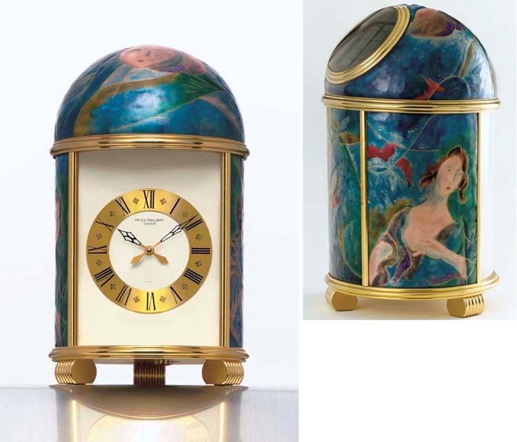 PATEK PHILIPPE. A FINE AND POSSIBLY UNIQUE GILT BRASS AND ENAMEL SOLAR-POWERED TABLE CLOCK
