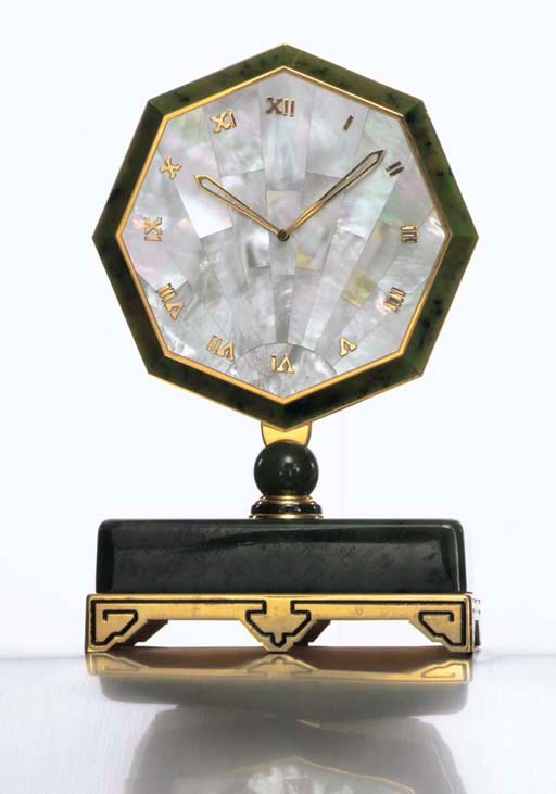 CARTIER. A LIMITED EDITION GILT-METAL, NEPHRITE AND MOTHER-OF PEARL DESK CLOCK