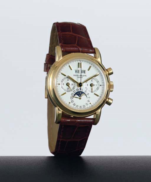 PATEK PHILIPPE. A FINE 18K GOLD PERPETUAL CALENDAR CHRONOGRAPH WRISTWATCH WITH MOON PHASES