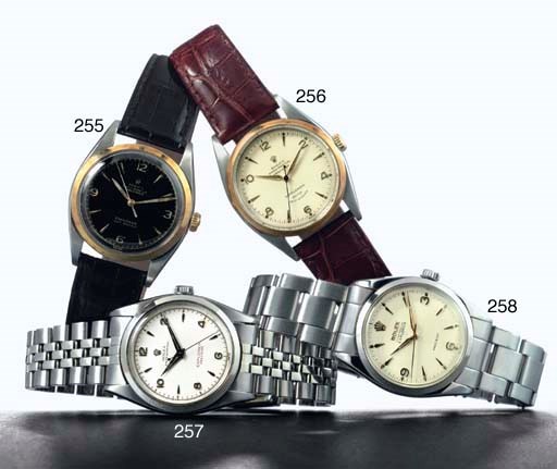 ROLEX. A STAINLESS STEEL AUTOMATIC WRISTWATCH WITH CENTER SECONDS AND BRACELET