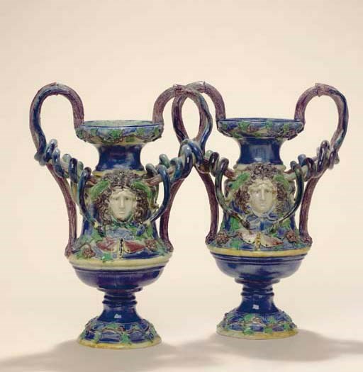 A PAIR OF FRENCH (SCHOOL OF PARIS) MAJOLICA PALISSY STYLE SNAKE-HANDLED VASES