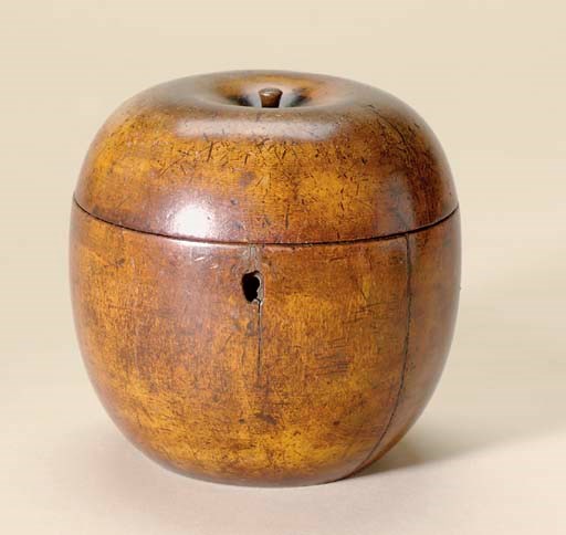 A GEORGE III FRUITWOOD APPLE-FORM TEA CADDY
