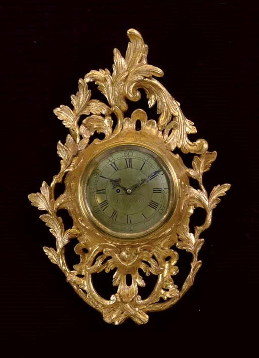 A GEORGE III GILTWOOD CARTEL CLOCK