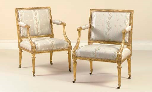 A PAIR OF GEORGE III GILTWOOD ARMCHAIRS