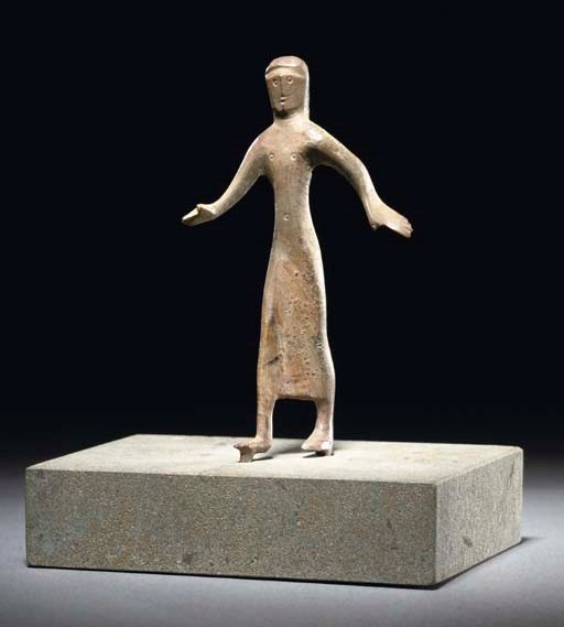 AN UMBRIAN BRONZE FEMALE FIGURE