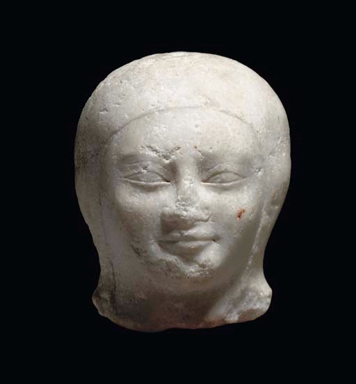 AN EAST GREEK MARBLE HEAD OF A KORE