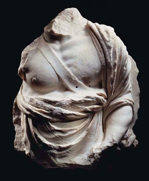 A HELLENISTIC MARBLE MALE TORSO FROM A RELIEF