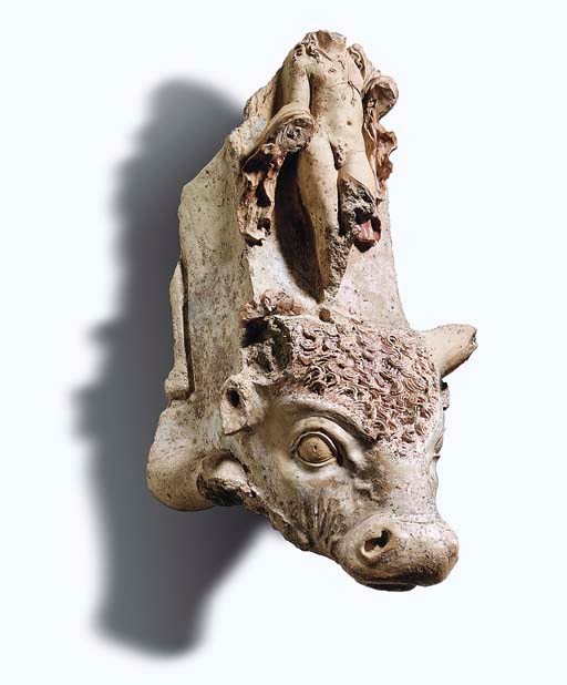A LARGE HELLENISTIC PAINTED TERRACOTTA HEAD OF A BULL