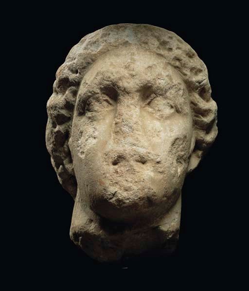 A GREEK MONUMENTAL MARBLE HEAD OF A GODDESS