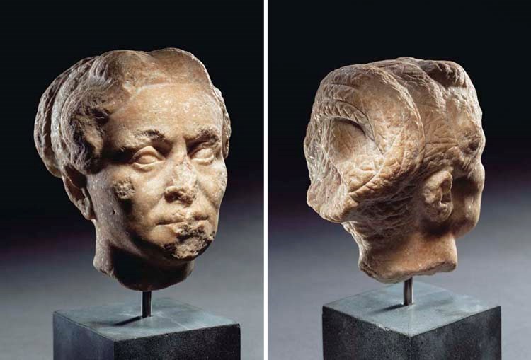 A ROMAN MARBLE FEMALE PORTRAIT HEAD