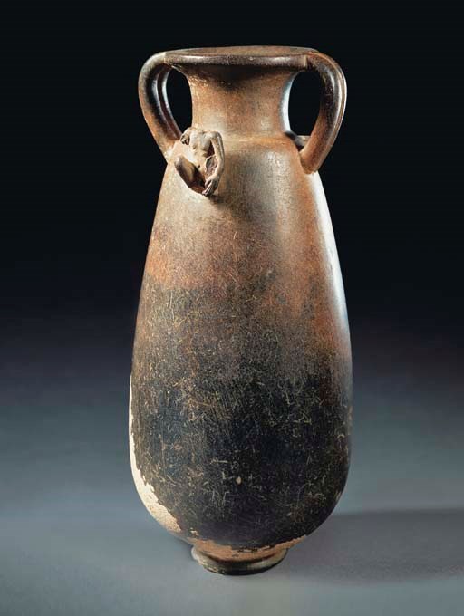 A HELLENISTIC HEAVY BROWN STONE JAR WITH MALE PROTOME